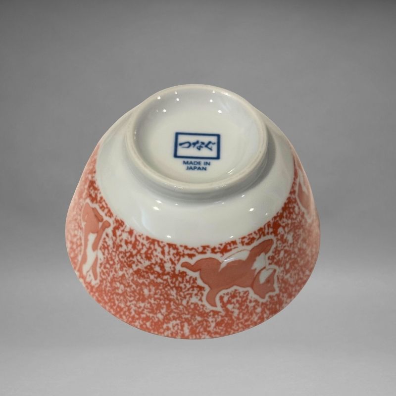 An inverted, bottom-up view of the small ceramic rice bowl, showing the white base and the blue 'つなぐ MADE IN JAPAN' mark stamped in the centre.