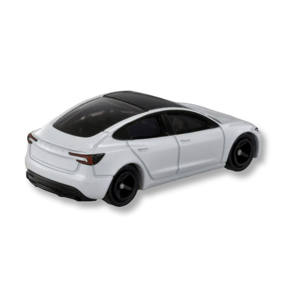 Rear three-quarter view of the white Tomica Tesla Model 3 diecast showing tail lights, glass roof and black wheels
