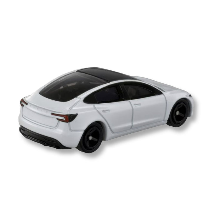 Rear three-quarter view of the white Tomica Tesla Model 3 diecast showing tail lights, glass roof and black wheels