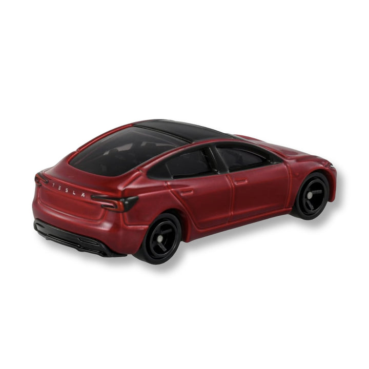 Rear three-quarter view of the red Tomica Tesla Model 3 First Edition showing TESLA lettering, tail lights and glass roof