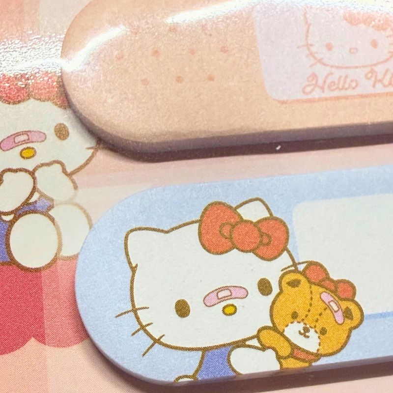 Hello Kitty and bear illustration on a small blue card with a pink background