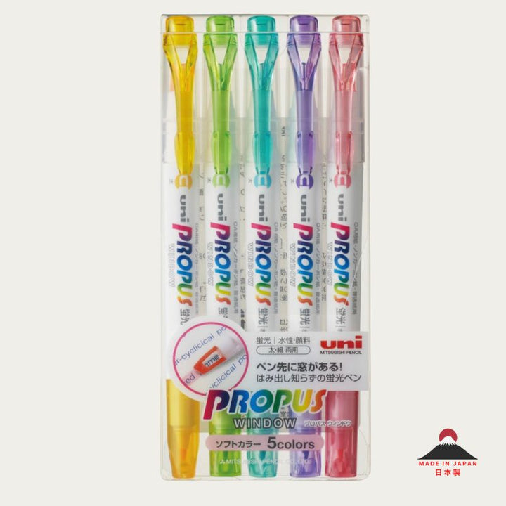 A clear plastic retail pack containing a 5-color set of Uni Propus Window highlighters in soft shades of yellow, green, aqua, purple, and pink. The packaging features the "uni" logo and "Soft Color" branding, with a "Made in Japan" seal in the corner.