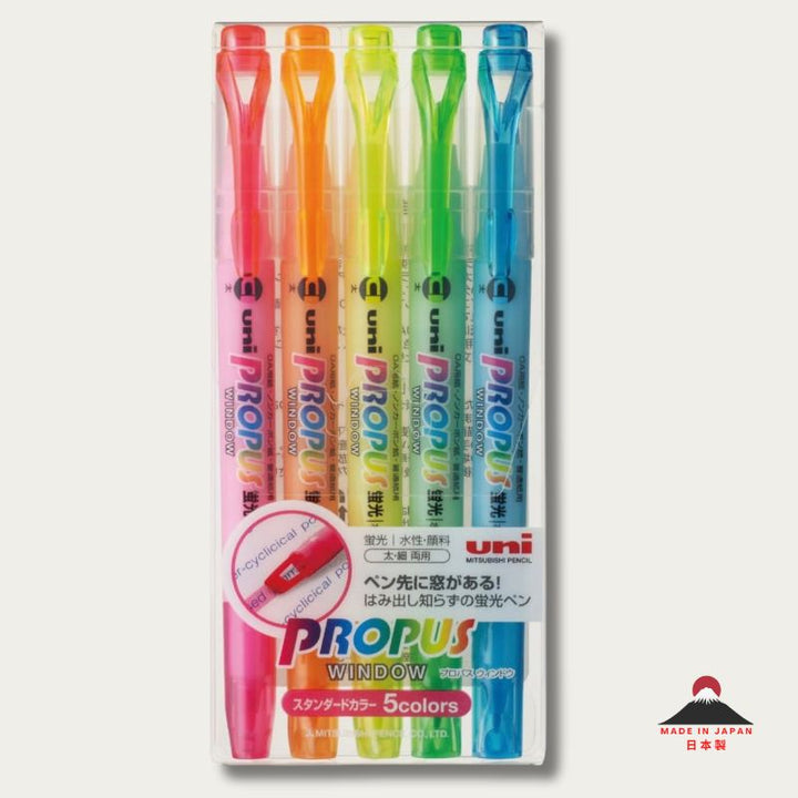 A promotional graphic for Uni Propus Window highlighters in neon pink, orange, yellow, green, and blue. A circular inset shows the pink window tip framing the word "WINDOW" to demonstrate precision.