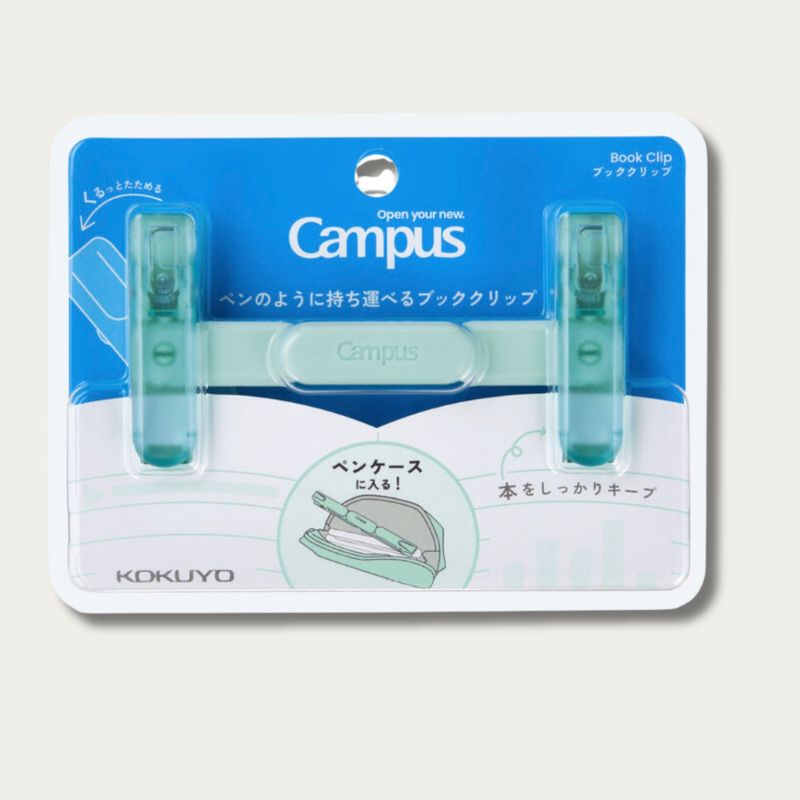 KOKUYO Campus book clip in a blister pack. The product consists of two translucent mint green book clips on a blue and white backing card with Japanese text.