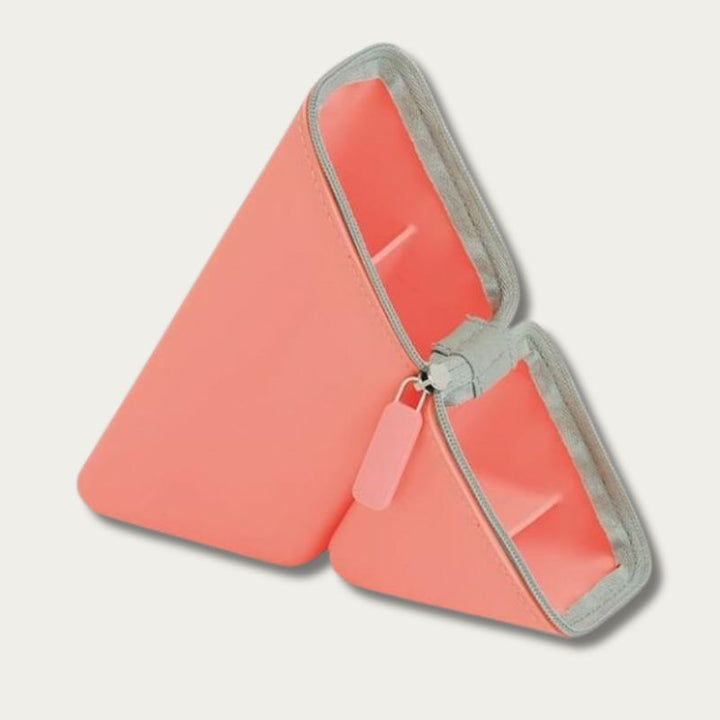 Sonic Kakusta pen stand in coral — triangular silicone body, zipper pull detail