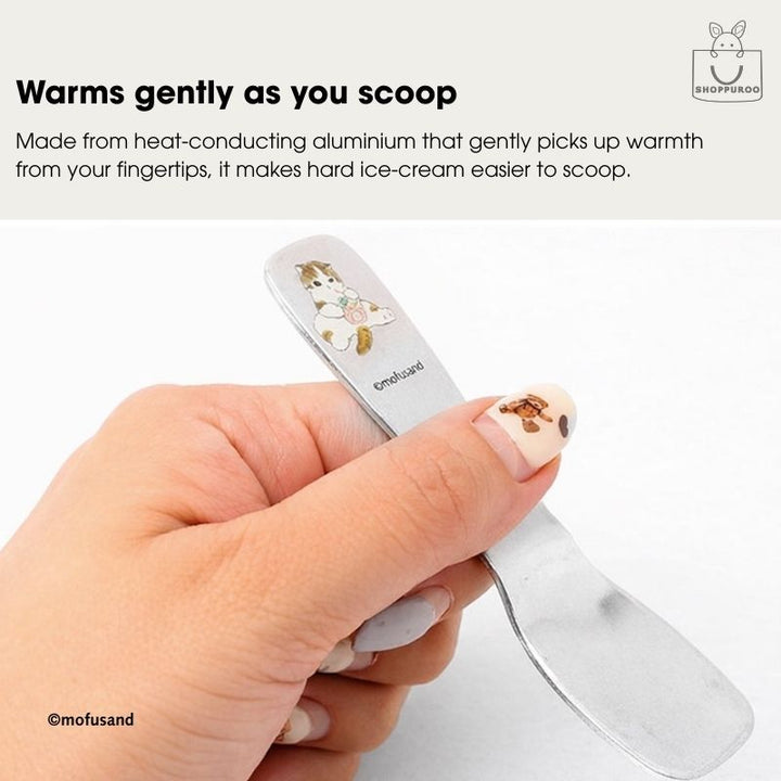Hand holding Mofusand heat-conducting aluminium ice cream spoon showing warm-to-touch grip for easier scooping hard ice cream, made in Japan.