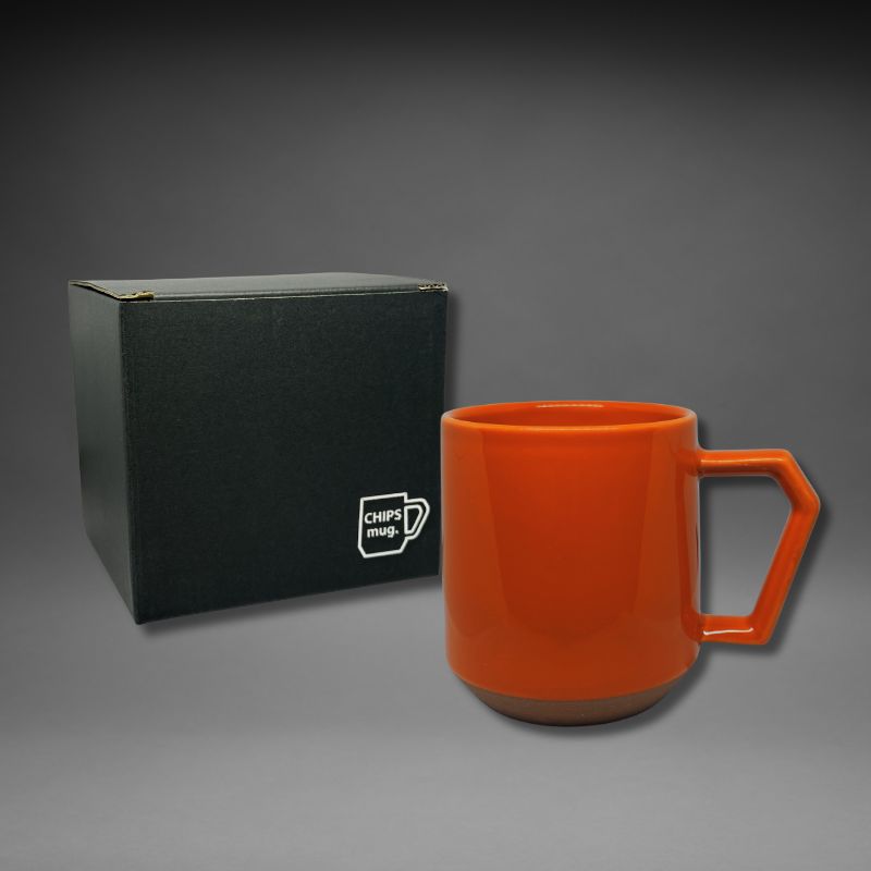Chips Mug 380ml in Orange, vibrant Japanese ceramic mug with unique handle design , a black gift box featuring CHIPS mug logo is included.
