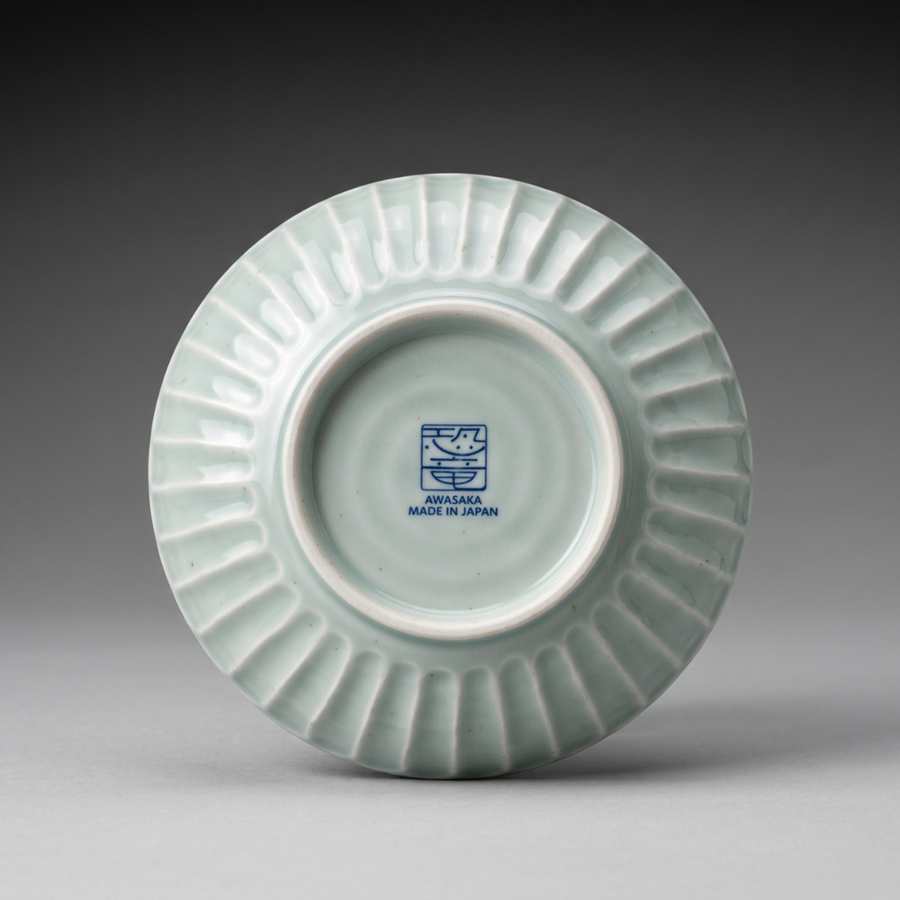 Underside of Edokko Dinosaur medium bowl showing shinogi ridged outer wall and AWASAKA Made in Japan back stamp