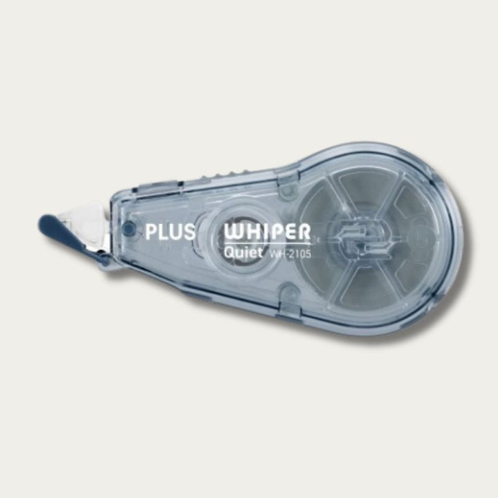 A PLUS Whisper Quiet correction tape with a translucent navy plastic body  shown on a light beige background.