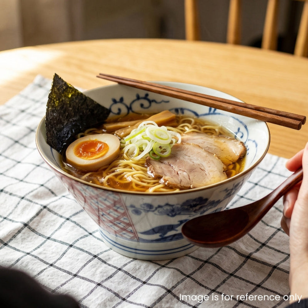 Edokko Dinosaur ramen bowl filled with shoyu ramen, chashu pork, soft-boiled egg, nori and spring onion, with chopsticks on a checked tablecloth
