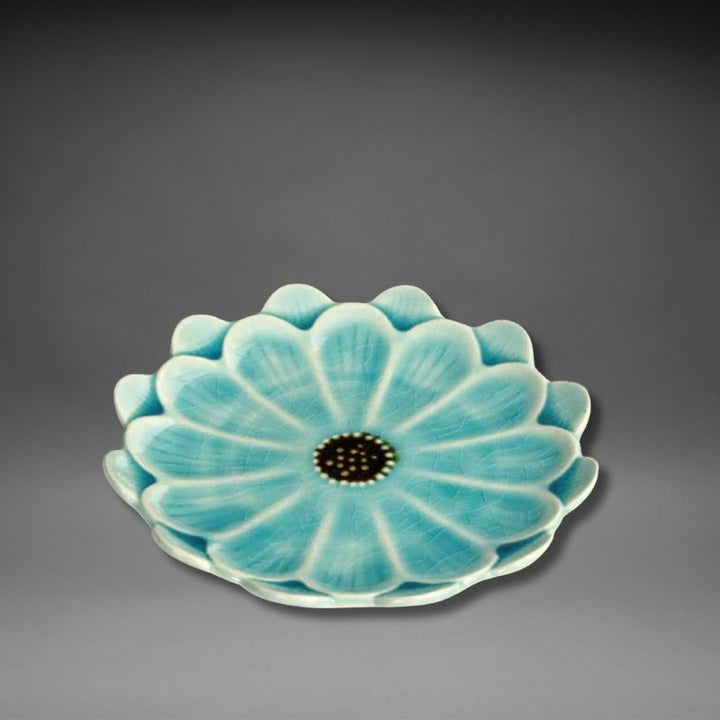 Side view of stacked turquoise blue Handmade Mino-ware Crackle Glaze Flower Mini Plates — elegant flower-shaped ceramics from Japan’s Fiore series.