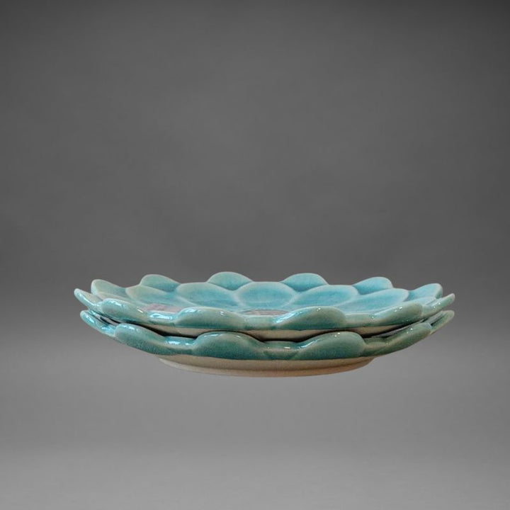 Handmade Mino-ware Crackle Glaze Flower Mini Plate in turquoise blue — Japanese ceramic plate from the Fiore series, showing petal edges and glossy crackle finish.