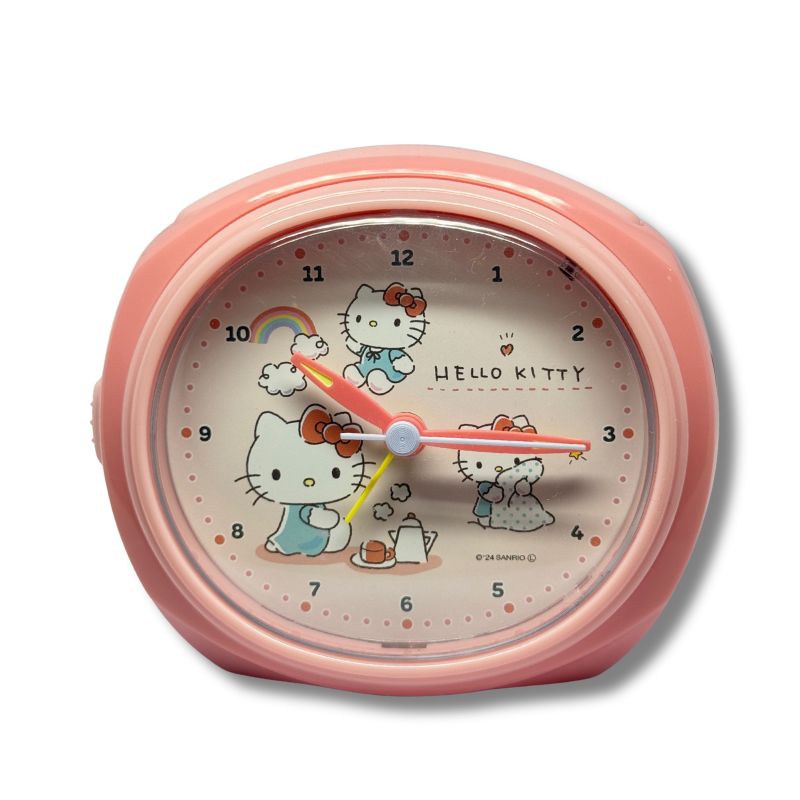 Hello Kitty Table Alarm Clock pastel pink front view showing Hello Kitty design with rainbow and tea set – Sanrio Japan.
