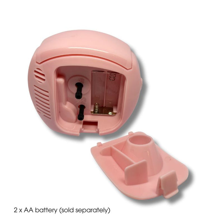 Hello Kitty Table Alarm Clock with battery cover removed, showing AA battery slots and mechanism – pink design.
