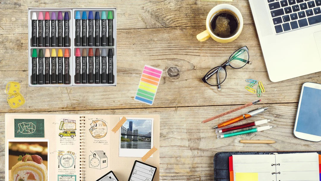 Japanese stationery collection — chalk pastels, pens, sticky tabs and bullet journal on a wooden desk — SHOPPUROO™