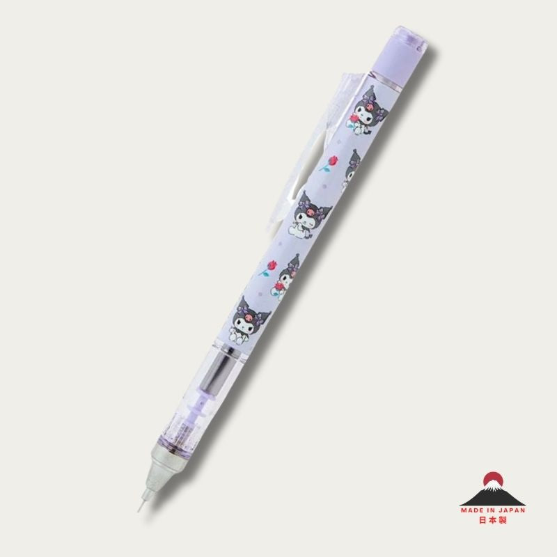 A full-length view of the Tombow Mono Graph x Sanrio Kuromi mechanical pencil showing the light purple character-patterned barrel, transparent grip section, and sleek "frenock" shake mechanism components.