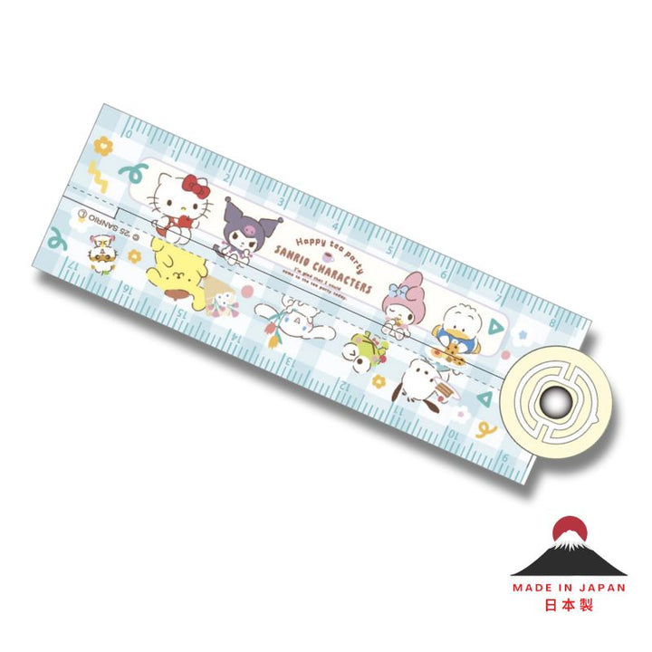 Sanrio Hello Kitty &amp; Friends 17cm folding ruler, Happy Tea Party design, featuring Hello Kitty, Kuromi, My Melody, Cinnamoroll, Pompompurin, Keroppi and Pochacco on a light blue checkered background. Made in Japan icon displayed.