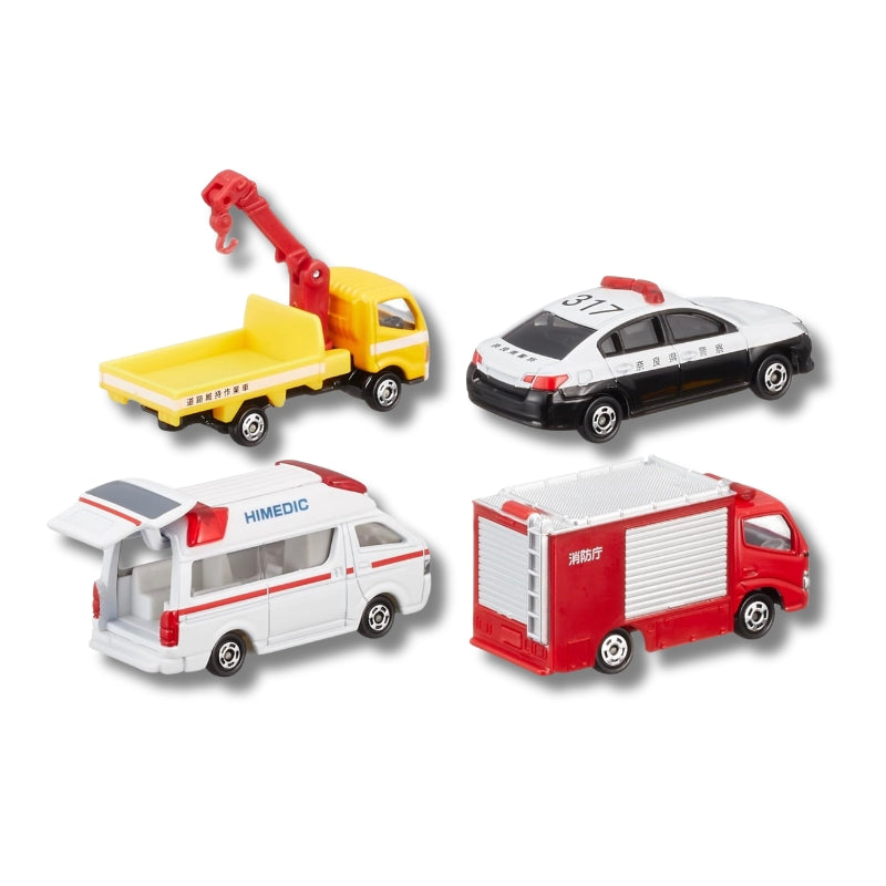 Tomica Emergency Vehicle Set 5 showing four vehicles — crane truck, police car, HiMedic ambulance with open rear door, and red fire engine — displayed on a white background.