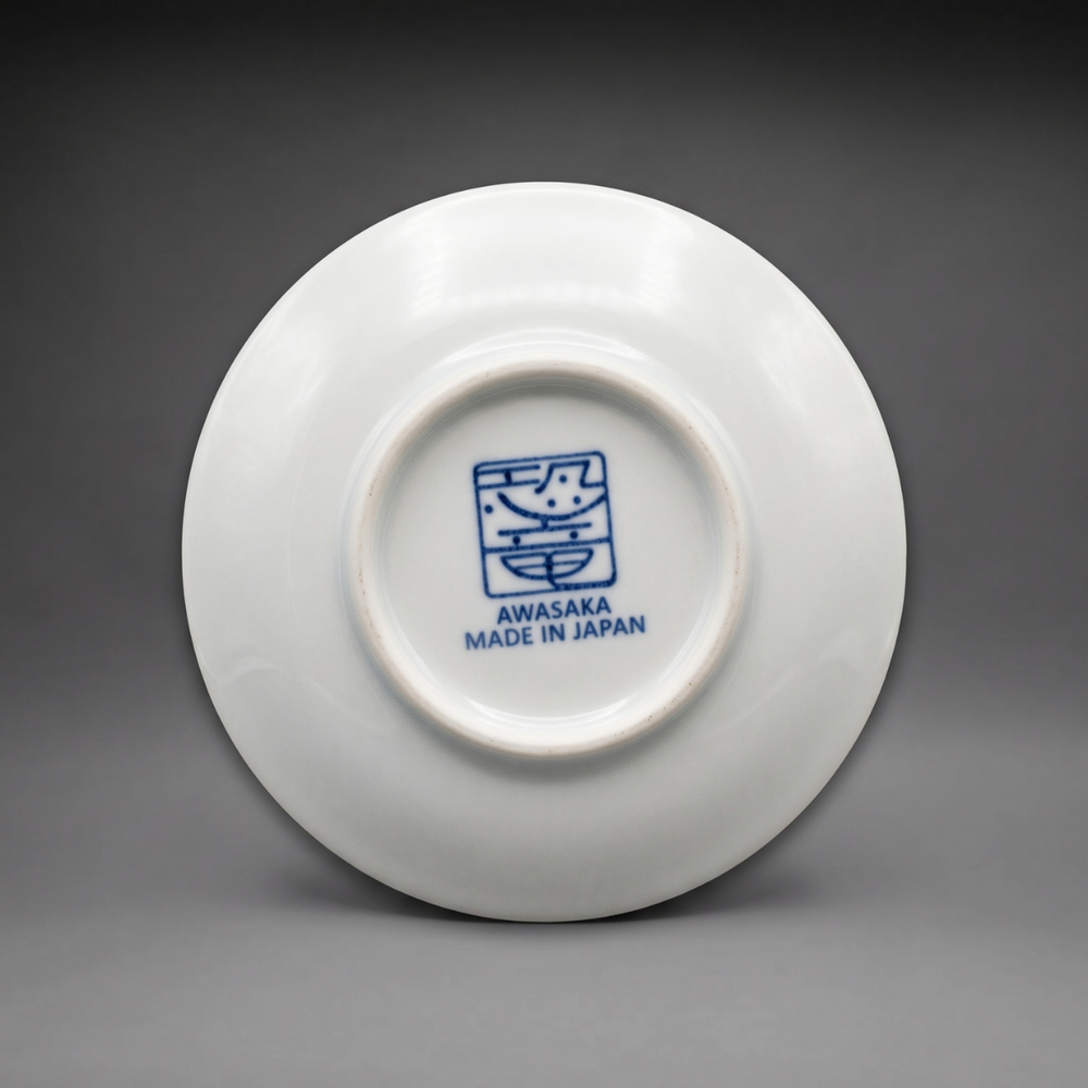 Underside of an Edokko Dinosaur mame plate with the blue Awasaka dinosaur stamp and Made in Japan mark