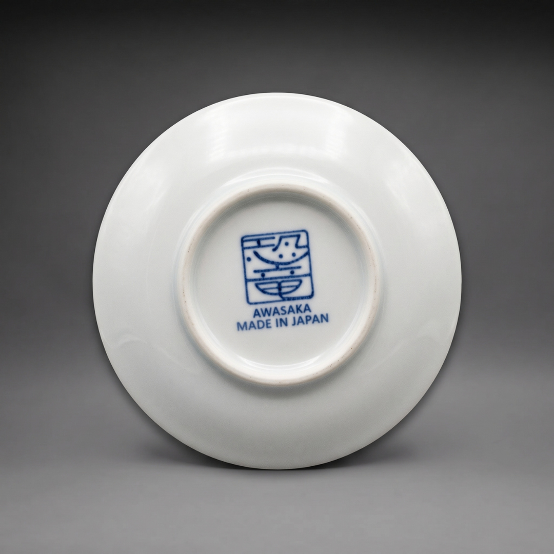 Underside of an Edokko Dinosaur mame plate with the blue Awasaka dinosaur stamp and Made in Japan mark