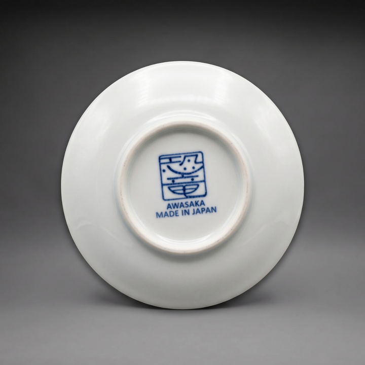 Underside of an Edokko Dinosaur mame plate with the blue Awasaka dinosaur stamp and Made in Japan mark