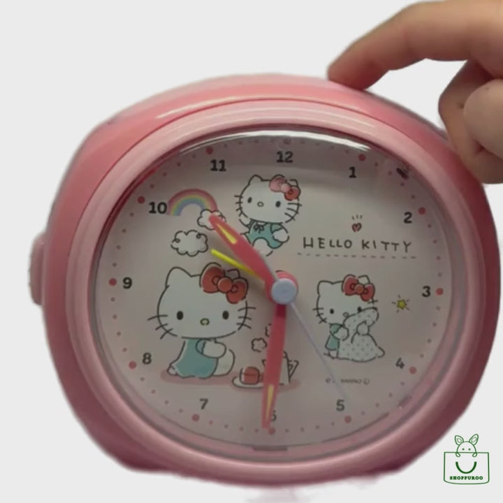 ello Kitty Table Alarm Clock – pastel pink Sanrio Japan alarm clock with cute morning scene design.